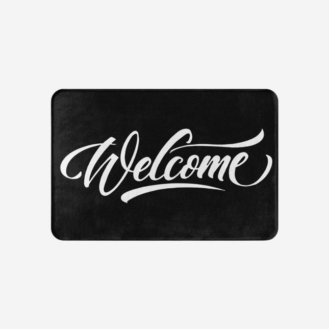 Sort dørmåtte med hvidt 'Welcome' print