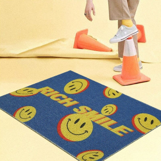 Dørmåtte med 'Rich Smile' design