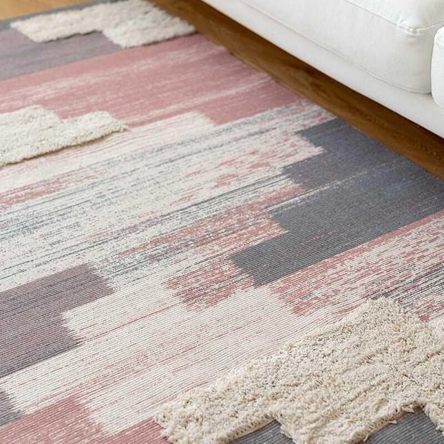 Lille lyserødt tæppe med frynser