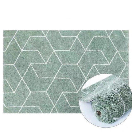 Mintgrønt shaggy tæppe med geometrisk mønster