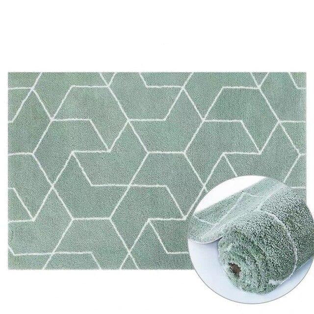 Mintgrønt shaggy tæppe med geometrisk mønster