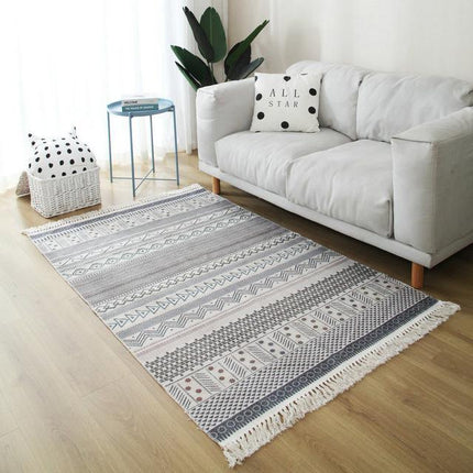 Beige og gråt tæppe med mønster