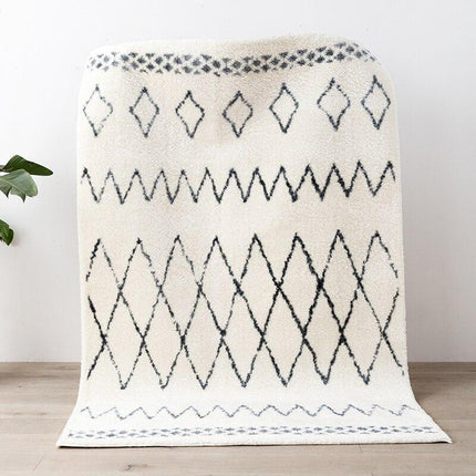 Elegant berbertæppe med sort mønster