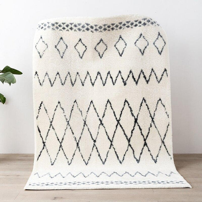 Elegant berbertæppe med sort mønster