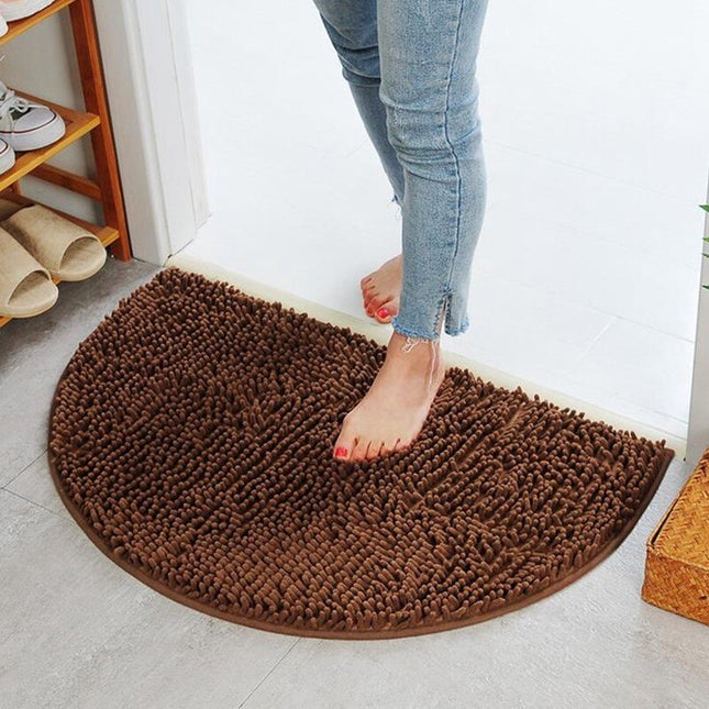 Brun halvmåneformet bademåtte