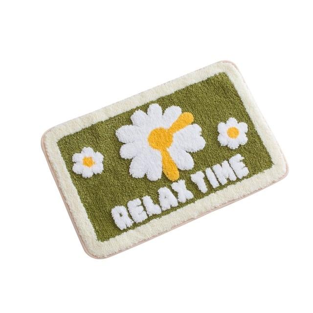 Bademåtte med græseffekt og blomster