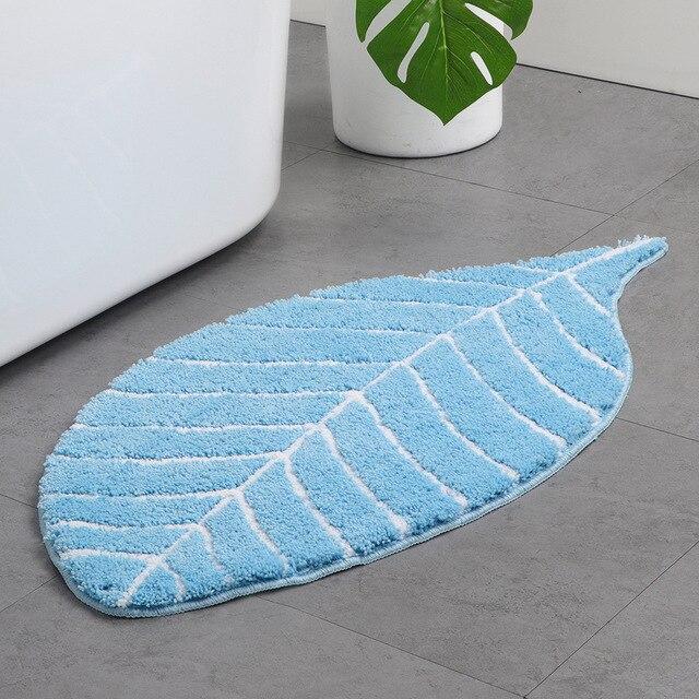 Blå bademåtte med blødt blad design