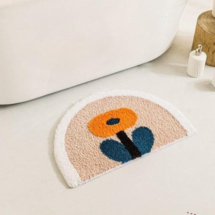 Halvrund bademåtte med orange blomst