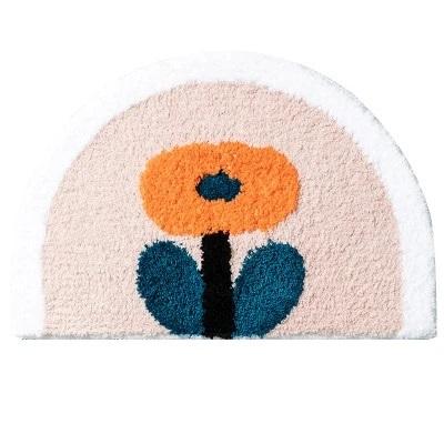 Halvrund bademåtte med orange blomst