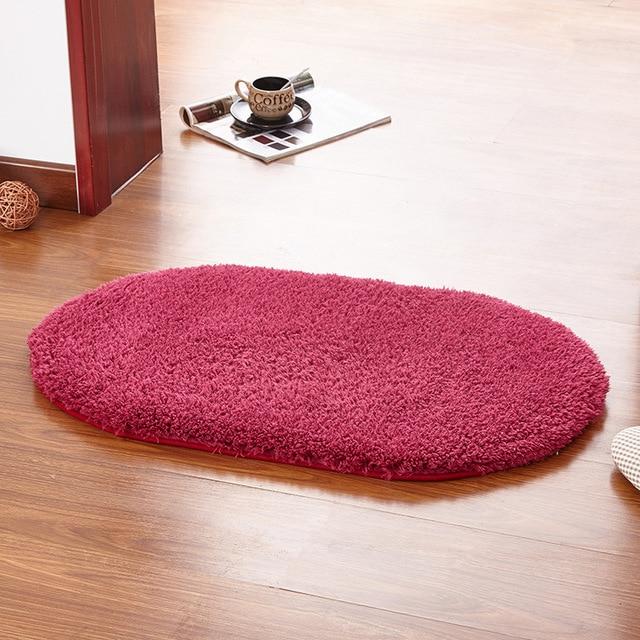 Fuchsiafarvet oval bademåtte til badeværelset