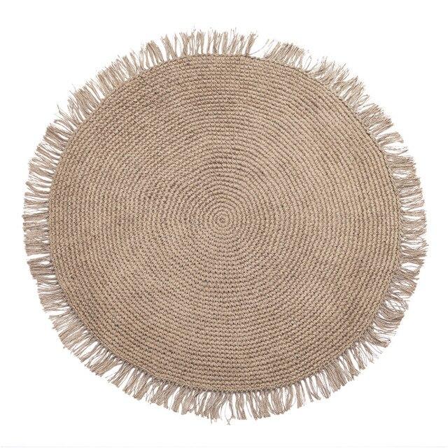 Rundt beige gulvtæppe af jute
