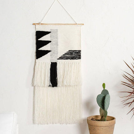 Hvidt vægtæppe med geometrisk mønster