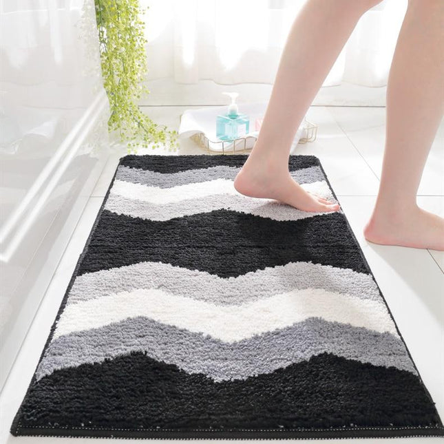 Sort og hvid bademåtte med bølgemønster