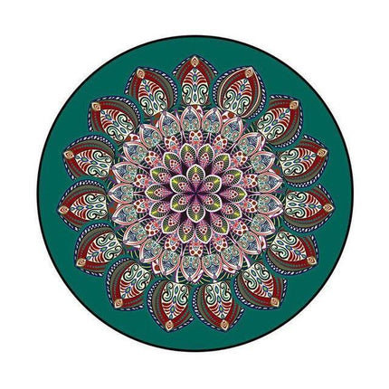 Rundt mørkegrønt gulvtæppe med mandala