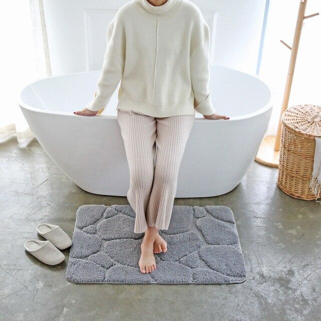 Grå bademåtte med 3D sten motiv