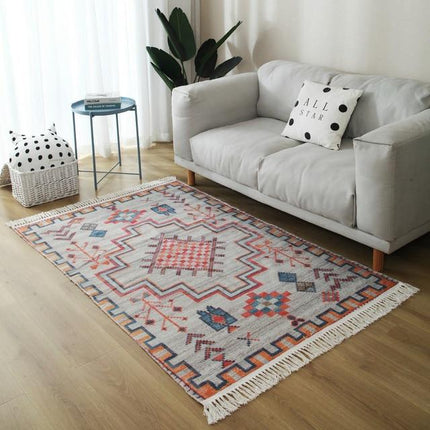 Stuetæppe i orange og grå