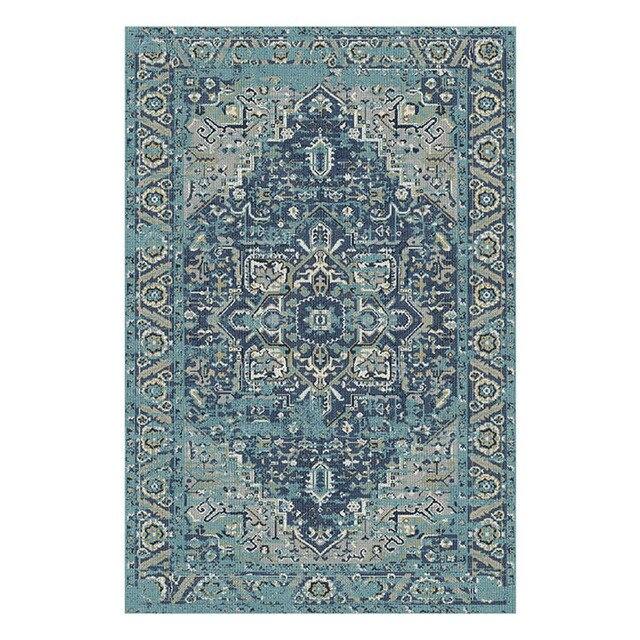 Blåt vintage gulvtæppe i industriel stil