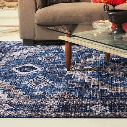 Blåt vintage gulvtæppe med etnisk mønster